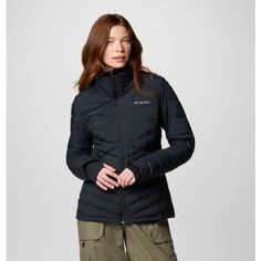 Warmth when you need it most. Beat frigid temps in this jacket with our most advanced thermal-reflective lining, lightweight insulation, and sleek fabric that blocks light rain. Black Columbia Jacket Woman, Black Moisture-wicking Windbreaker For Hiking, Womans Columbia Jacket, Outdoor Nylon Hooded Jacket With Moisture-wicking, Columbia, Sleek, Fabric, Black