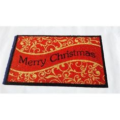 merry christmas door mat with gold swirls and red ribbon on white background, front view