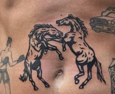 a man with tattoos on his stomach has two horses and a car in the background