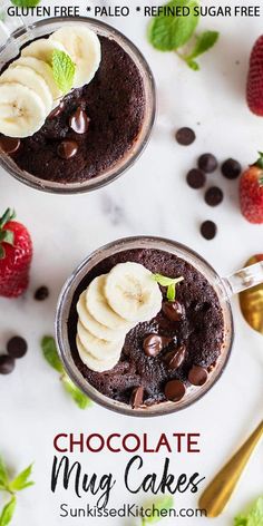 two chocolate mug cakes with bananas and chocolate chips on the side next to strawberries