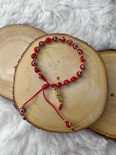 Mexican red protection bracelet -evil eye -San Juditas charm -mal de ojo protection -hand made in Mexico -adjustable size Handmade Red Symbolic Beaded Bracelets, Red Evil Eye Bracelets For Good Luck, Red Evil Eye Bracelet For Good Luck, Red Symbolic Handmade Bracelets, Handmade Red Evil Eye Bracelet For Good Luck, Red Evil Eye Bracelet Gift, Adjustable Red Rosary Bracelet, Adjustable Red Evil Eye Bracelet, Hand-strung, Adjustable Red Evil Eye Bracelet Hand-strung