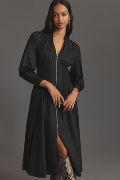 Your ticket to around-the-clock compliments. Crafted from crisp cotton, the Tommie Dress begins with captivating long sleeves and a plunging v-neckline, accented by an elongating zip-front detail and punctuated with a swingy midi skirt. | The Tommie Smocked Front-Zip Shirt Dress: Long-Sleeve Edition by Anthropologie in Black, Women's, Size: XS, Cotton/Modal Code Clothing, Smocked Dress, Long Shirt Dress, Green Midi Dress, Black Shirt Dress, Long Sleeve Shirt Dress, Black Midi Dress, V Neck Dress, Day Dresses