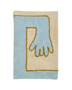 a blue and beige rug with an image of a hand on the front of it