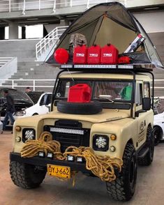 an off - road vehicle with life preservers on the roof