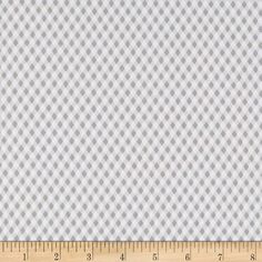 a ruler is next to a white and gray checkerboard pattern on the wall