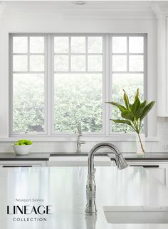 a kitchen with white cabinets and marble counter tops is featured in the magazine lineage collection