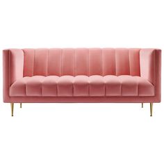 a pink velvet couch with gold legs