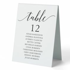 a white table number card with black lettering