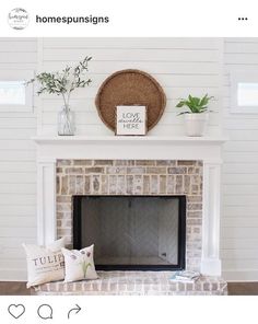 the fireplace is decorated with white paint and some decorations on it, including a sign that says