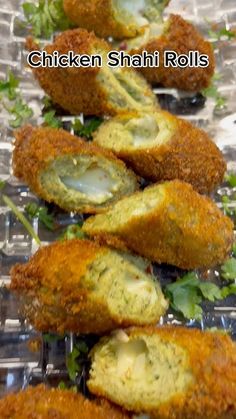 chicken shaff rolls are lined up on a clear tray