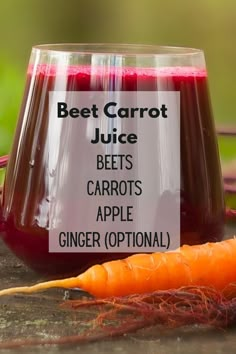 a carrot sitting next to a jar of juice