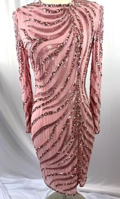 Fun and festive pink sequin silk long sleeve dress.  This dress is ready for a party!  It is in great condition and so sparkly.  Pretty in pink 1980's style.  Looking for a fun dress for your night out?  This is a beautiful dress!  100% silk, runs small. 39" long 24.5" sleeve 38.5" bust 30" wide Pet free/smoke free Enjoy! Long Sleeve Vintage Dress, Pink Sequin Party Dress, Silk Long Sleeve Dress, Long Sleeve Vintage Dresses, 1980's Style, Sequin Party, Dress Retro, Fun Dress, Sequin Party Dress