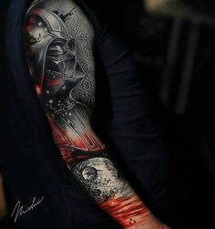 a man's arm with a star wars tattoo on it, and the image of darth vader