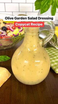 an image of a salad dressing recipe in a glass bottle on a wooden table with basil leaves