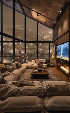 a living room filled with furniture and a flat screen tv mounted to the side of a wall