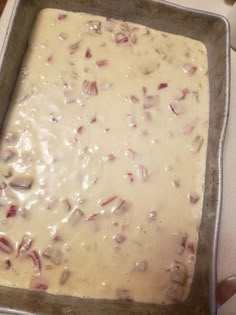 a pan filled with food sitting on top of a counter