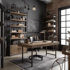 an industrial office with black walls and wooden shelves on either side of the desk is a large open bookcase