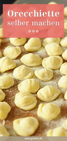 a pan filled with dumplings on top of a table next to a red sign