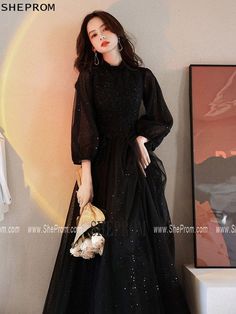 Buy Modest Black Long Tulle Formal Dress with Long Lantern Sleeves id#AM6097 at SheProm. SheProm.com is an online store with thousands of formal dresses. Shop 100% authentic prom dresses with free standard shipping. Long Black Dress With Long Sleeves, Black Prom Dresses Long Sleeve, Classy Modest Dresses Formal, Long Formal Dresses With Sleeves, Flowy Long Sleeve Prom Dress, Black Dresses For Birthday, Black Prom Dress With Sleeves, Black Prom Dress Modest, Elegant Black Dress Classy Long