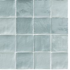 a white tile wall that is made up of square tiles