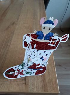 a christmas stocking shaped like a mouse