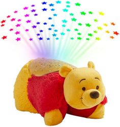 a winnie the pooh stuffed animal with stars on it