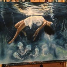 a painting of a woman floating in the ocean