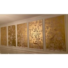 four panels with flowers and birds painted on them in gold, white and silver colors