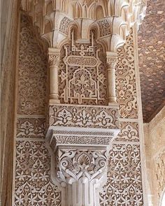 an intricately carved wall in the middle of a building