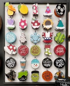 a display case filled with lots of different types of decorated cookies on top of each other