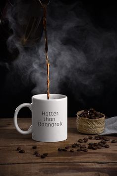 coffee being poured into a mug with the words hotter than ragnarok on it