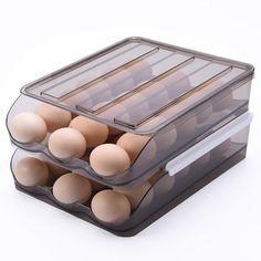 an assortment of eggs in a container on a white background