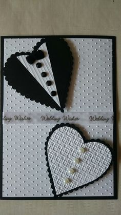 two pieces of paper that have been made to look like hearts and tuxedos