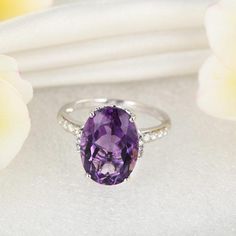 14K White Gold 5.75 Ct Oval Purple Amethyst 0.22 Ct Natural DiamondMade from top-quality Amethyst and natural diamond and solid 14k White Gold to last forever. Handcrafted to perfection to achieve exceptional brilliance and radiance like no other. This ring is made for you, for your loved ones, and the one who loves you.MATERIALSMetal: Solid 14K / 585 White GoldMain Stone: AmethystStone type: NaturalStone Shape: OvalStone Size : 14 mm x 10 mm (5.75 Carat)Stone Cut: ExcellentStone Detail: Color: Purple Diamond Engagement Ring, Purple Diamond Ring, Wooden Rings Engagement, Purple Stone Rings, Amethyst And Diamond Ring, Purple Diamond, White Gold Engagement Ring, Natural Diamond Ring, Luxury Rings