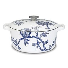 a blue and white casserole with flowers painted on it's side, in front of a white background