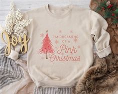 Stay warm and stylish during the chilly holiday season with our "I'm Dreaming of a Pink Christmas" sweatshirt. This sweatshirt takes the festive cheer to the next level: The sweatshirt is a cozy canvas of various shades of pink, creating a warm and inviting ambiance that's perfect for staying snug during the holidays. Just like the shirt, the sweatshirt features delicate pink snowflakes, adding an extra touch of wintry charm. The joyful phrase "I'm Dreaming of a Pink Christmas" adorns the front of the sweatshirt. Embrace the magic of a "Pink Christmas" and make it a truly unforgettable holiday season with this delightful sweatshirt. Pink Christmas Sweatshirt, Christmas Sweater, Christmas Gift, Hot Pink Sweatshirt, Pink Christmas, Colorful Sweater, Thinking Of You Gift How to Order T-shirt Hot Pink Sweatshirt, Pink Sweatshirt, Christmas Sweatshirts, Pink Christmas, Colorful Sweaters, Stay Warm, Christmas Sweaters, Hot Pink, Holiday Season