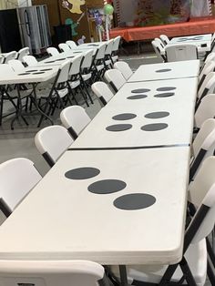 rows of tables and chairs with polka dots on them