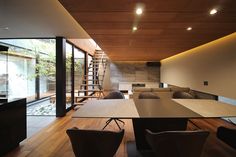 an empty conference room with wooden floors and walls