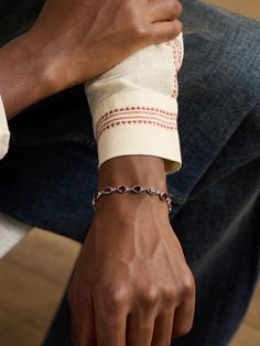 PATTARAPHAN's 'Ying' bracelet has been crafted in its native Bangkok from polished 14-karat white gold. It's modelled after traditional Thai bracelets and bezel-set with faceted garnet stones, including one at the end of the adjustable chain. Polish it with a cloth every so often to retain its shine. Bracelet With Stone, Men Bracelet, Garnet Bracelet, Summer Sunglasses, Garnet Stone, Fine Jewelry Bracelets, Bracelet For Men, Fine Jewelry Designers, Classic Sneakers