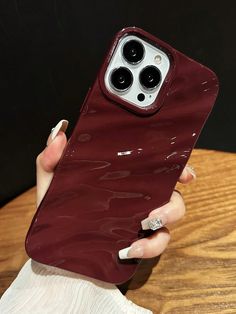 a woman holding an iphone 11 case in her hand, with the back cover partially covered