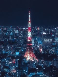 the tokyo tower is lit up in red and white