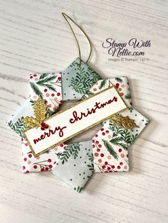 a christmas ornament hanging from a wooden table