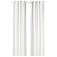 two white curtains hanging on the side of a window with metal rod ends and an eyelet