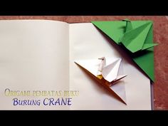 an origami paper boat on top of a book with the words burning crane