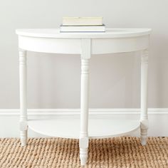 a white table sitting on top of a carpeted floor next to a wall with an american flag