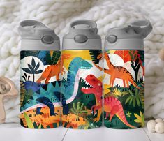 two insulated water bottles with dinosaurs on them