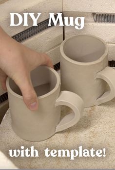 two coffee mugs are being held up by someone's hand with the words diy mug on it