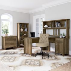 an office with a desk, chair and bookcase in the middle of the room