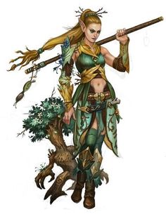 a woman dressed in green and gold holding a stick with leaves on her shoulders, standing next to a tree