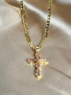 This stunning combination of pink and gold make this necklace so eye catching! Made with a 24K gold filled anchor link chain and a 14K gold-filled pink cubic zirconia cross pendant. It is affordable but looks very high quality! Quick Specs:  + 24k Gold filled chain  + 14k gold filled CZ Cross + Length: is 19.5 inches Pink Cross Necklace, Gold Chain Necklace Womens, Pink Gold Necklace, Pink Cross, Gold Filled Necklace, Luxe Jewelry, Gold Cross Necklace, Cross Chain, Jewelry Accessories Ideas